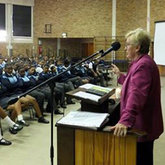 Marilyn Barker motivating students at Emil Weder High School